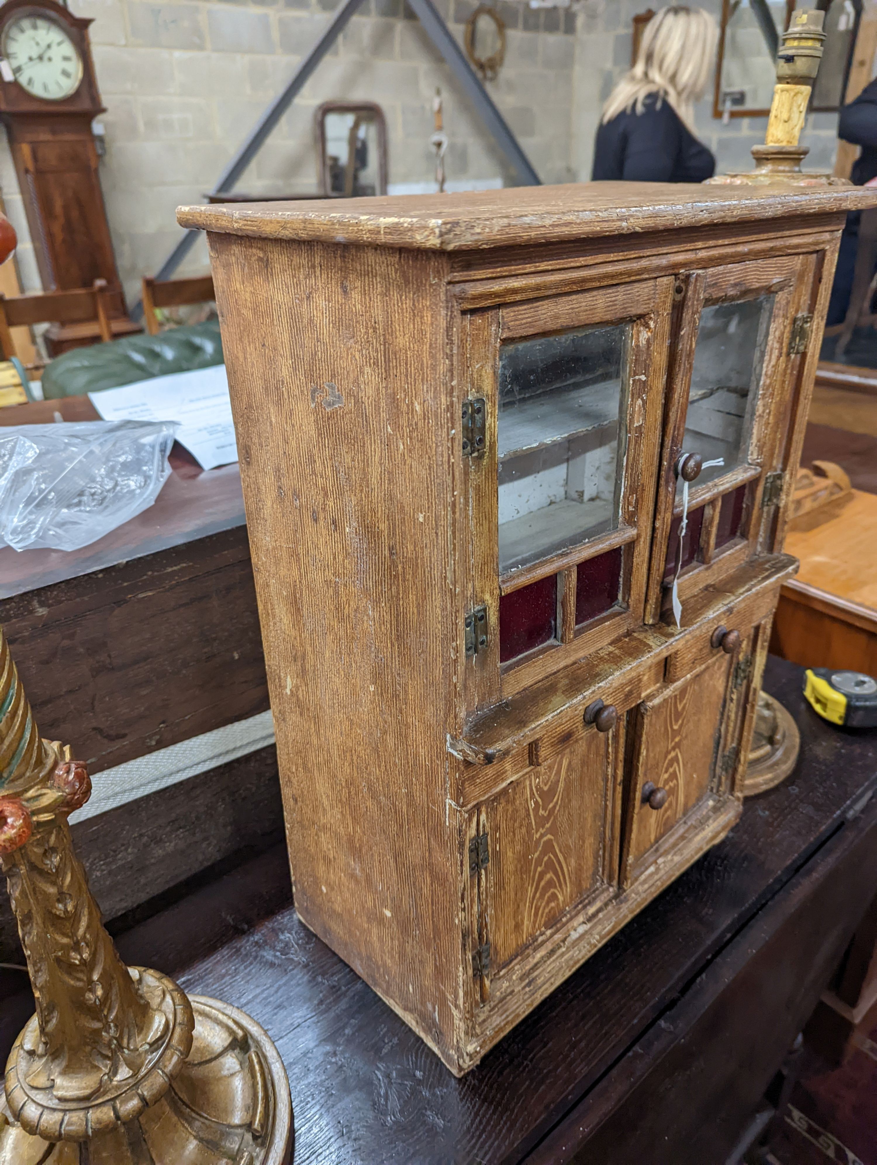 A 19th century Continental grained pine miniature dresser, width 39cm, depth 24cm, height 56cm